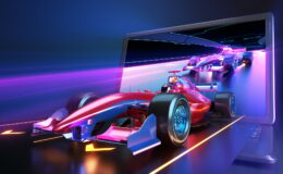 Racing car flying out of laptop screen